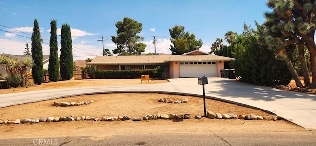 57825 El Dorado Dr, Yucca Valley, CA 92284 - ranch-style home featuring curved driveway and a garage