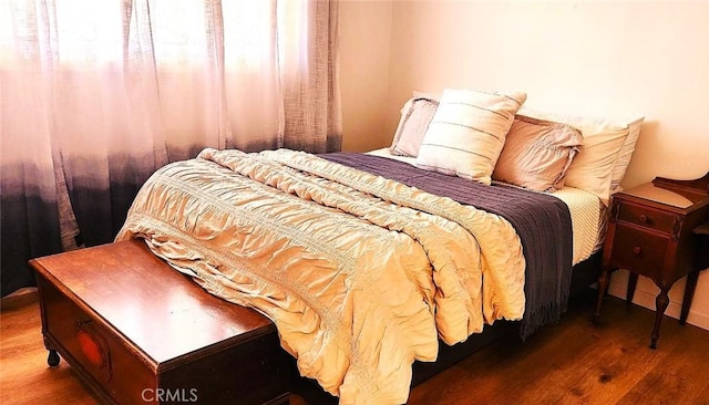 bedroom featuring wood finished floors