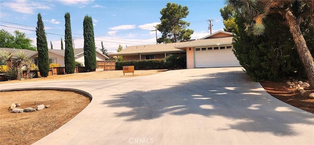 ranch-style home featuring a garage