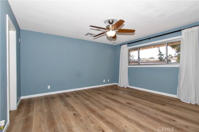 57825 El Dorado Dr, Yucca Valley, CA 92284 - empty room with ceiling fan and wood finished floors