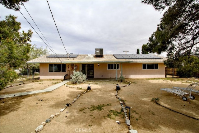 57825 El Dorado Dr, Yucca Valley, CA 92284 - view of front of property featuring roof mounted solar panels and stucco siding
