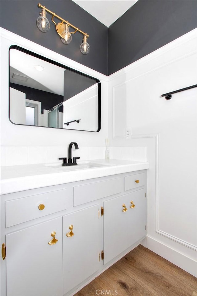 57825 El Dorado Dr, Yucca Valley, CA 92284 - bathroom with vanity and wood finished floors