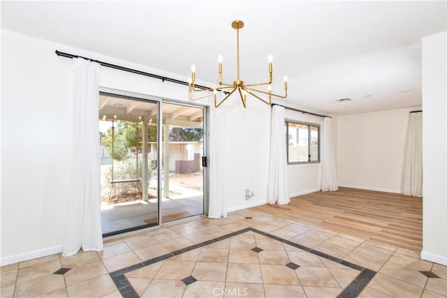 57825 El Dorado Dr, Yucca Valley, CA 92284 - unfurnished room featuring a chandelier, tile patterned floors, and inlaid floor details