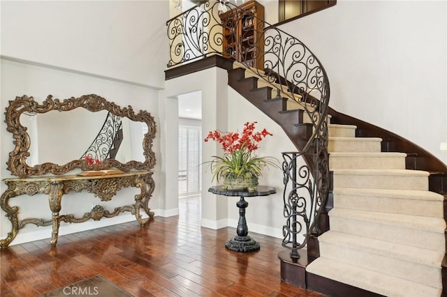 stairs featuring hardwood / wood-style flooring