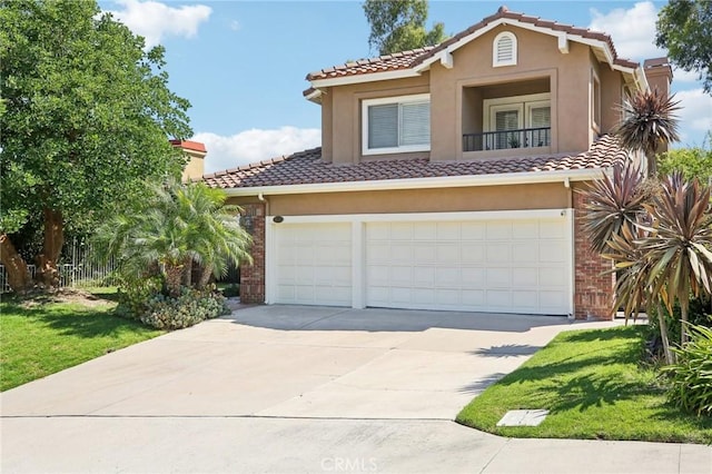 mediterranean / spanish house with a garage