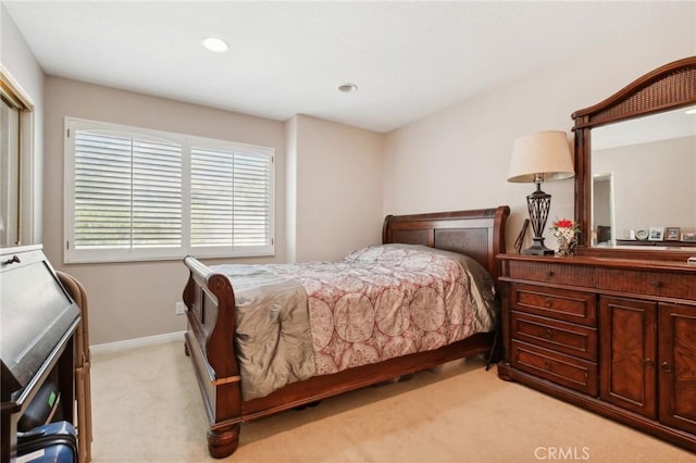 bedroom with light carpet