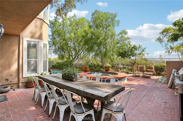 view of patio / terrace featuring outdoor lounge area and a swimming pool with hot tub