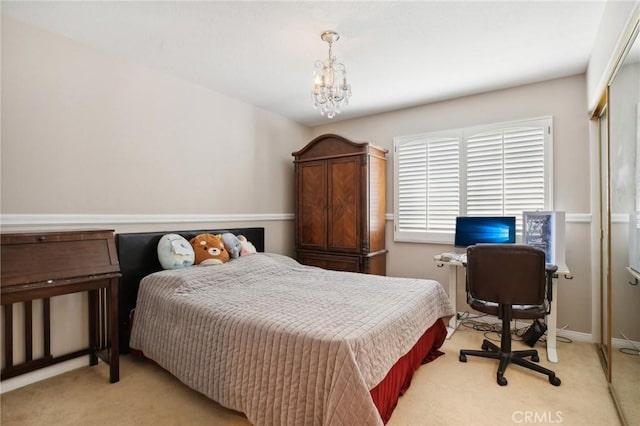 carpeted bedroom with a chandelier