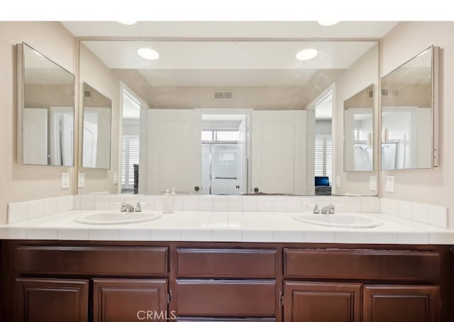 bathroom featuring vanity and a healthy amount of sunlight