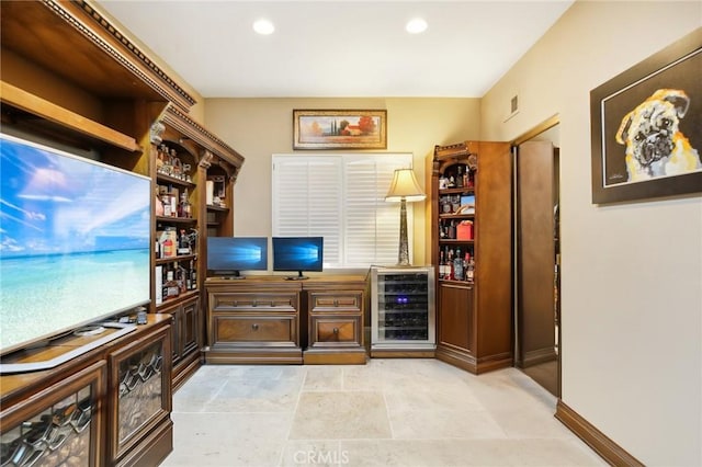 office area with indoor bar and beverage cooler