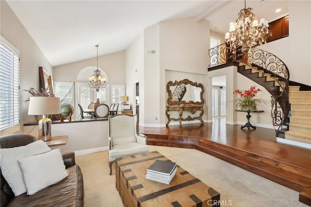 living room featuring beamed ceiling, light carpet, high vaulted ceiling, and an inviting chandelier