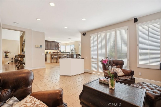 tiled living room featuring plenty of natural light