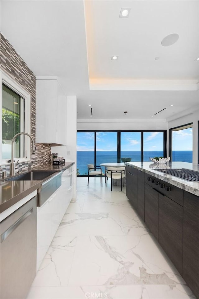 67 Monarch Bay Dr, Dana Point, CA 92629 - kitchen featuring white cabinets, modern cabinets, dishwasher, and a sink