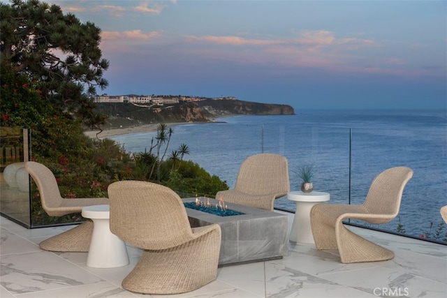 patio terrace at dusk with a water view