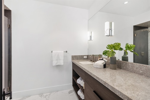 bathroom featuring an enclosed shower and vanity