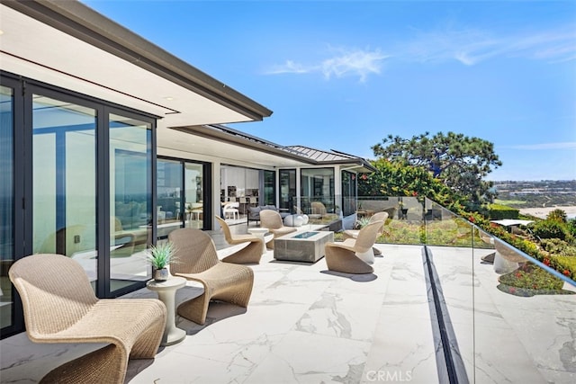 view of patio with a balcony and an outdoor hangout area