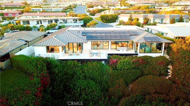 rear view of house featuring a patio