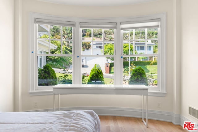 bedroom with light wood-type flooring