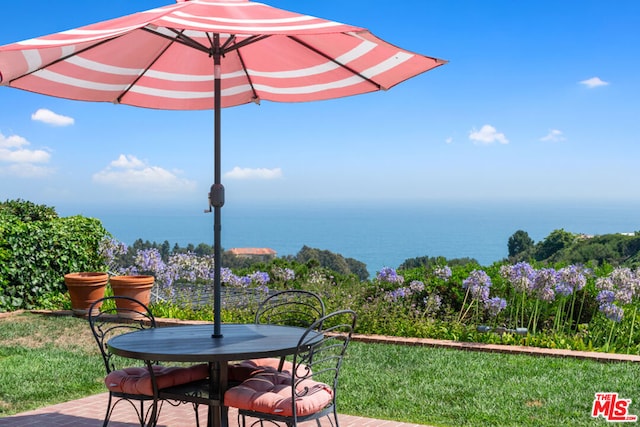 view of patio / terrace with a water view