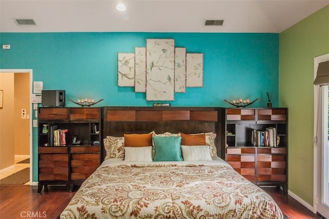 bedroom featuring dark wood-type flooring