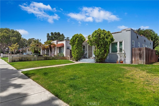 view of front of home with a front lawn