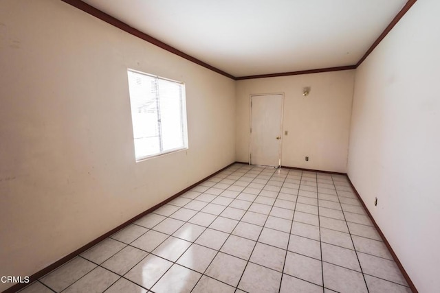 unfurnished room featuring crown molding and light tile patterned floors