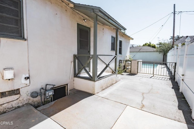 view of property exterior with a patio