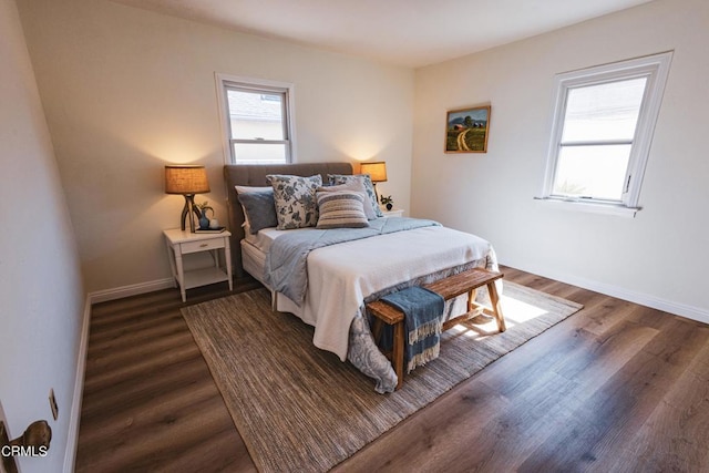 bedroom with dark wood-type flooring