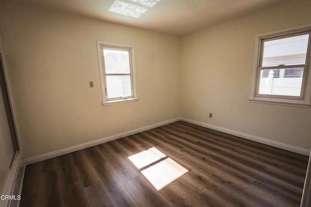 spare room featuring dark hardwood / wood-style floors