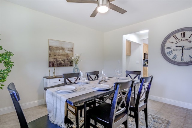 tiled dining room with ceiling fan