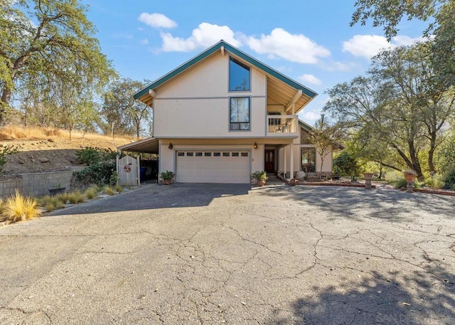 view of front facade with a garage and a carport