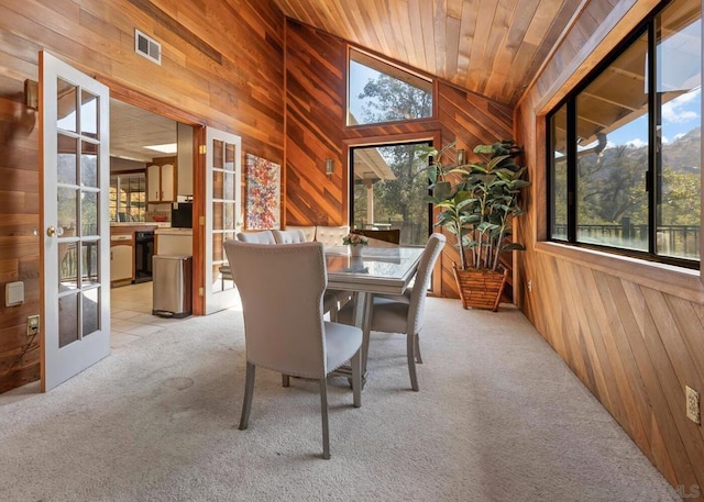 sunroom with french doors, wooden ceiling, and vaulted ceiling