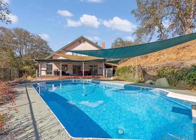 view of swimming pool featuring a patio