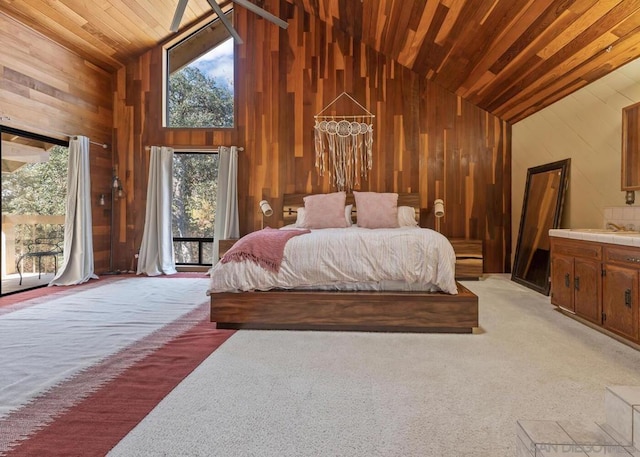 bedroom featuring access to outside, multiple windows, high vaulted ceiling, and carpet