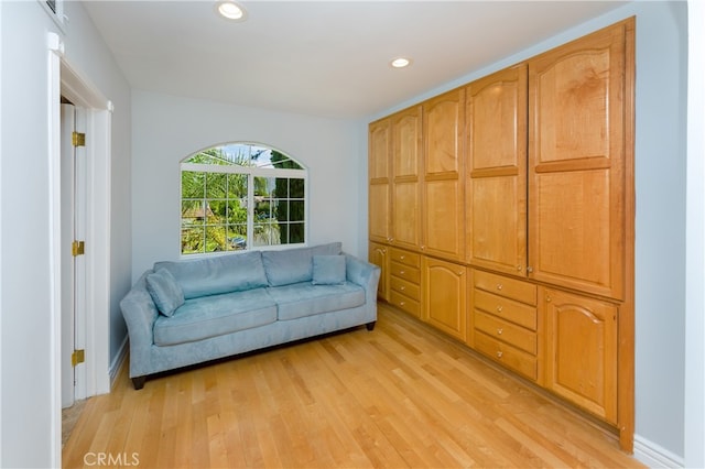 sitting room with light hardwood / wood-style flooring