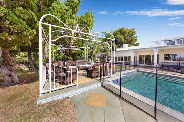 view of pool with an outdoor living space