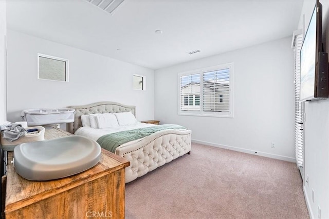 bedroom with light colored carpet