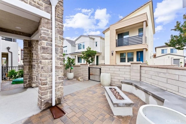 view of patio with an outdoor fire pit