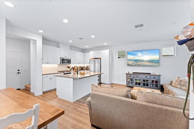 living room with light hardwood / wood-style floors