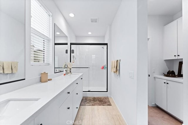 bathroom featuring vanity and walk in shower