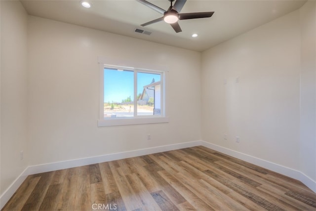 empty room featuring light hardwood / wood-style floors and ceiling fan