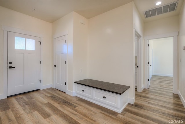 foyer with light hardwood / wood-style floors