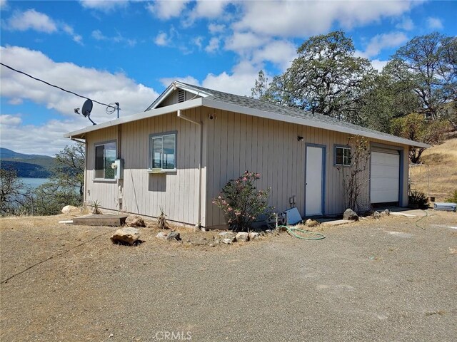 view of side of property featuring a garage