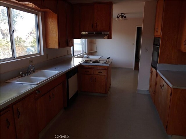 kitchen featuring black oven, white gas cooktop, dishwasher, and sink