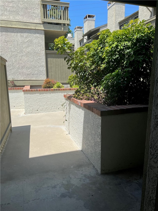 view of patio featuring a balcony