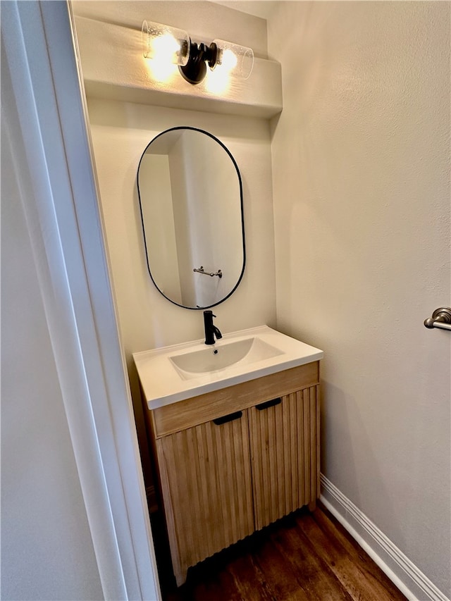 bathroom featuring wood-type flooring and vanity