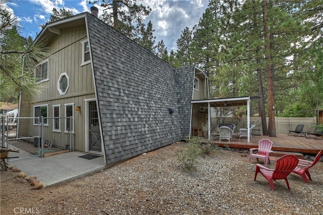 rear view of property with a deck