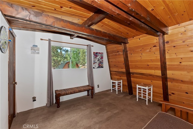 bonus room featuring wood ceiling, lofted ceiling with beams, and dark colored carpet