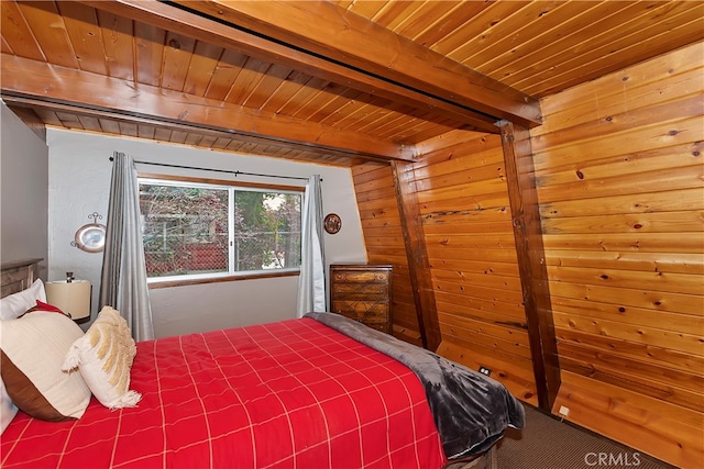 bedroom featuring beam ceiling and wood ceiling