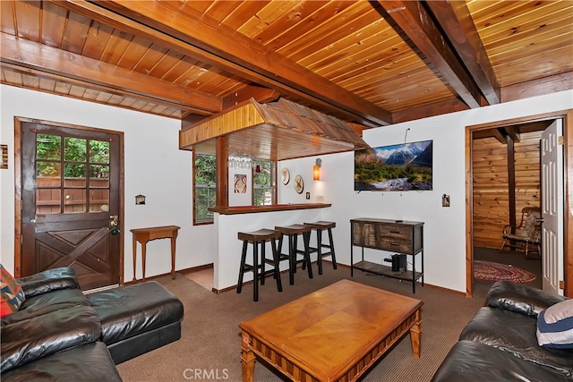 carpeted living room with beamed ceiling, wooden ceiling, and indoor bar